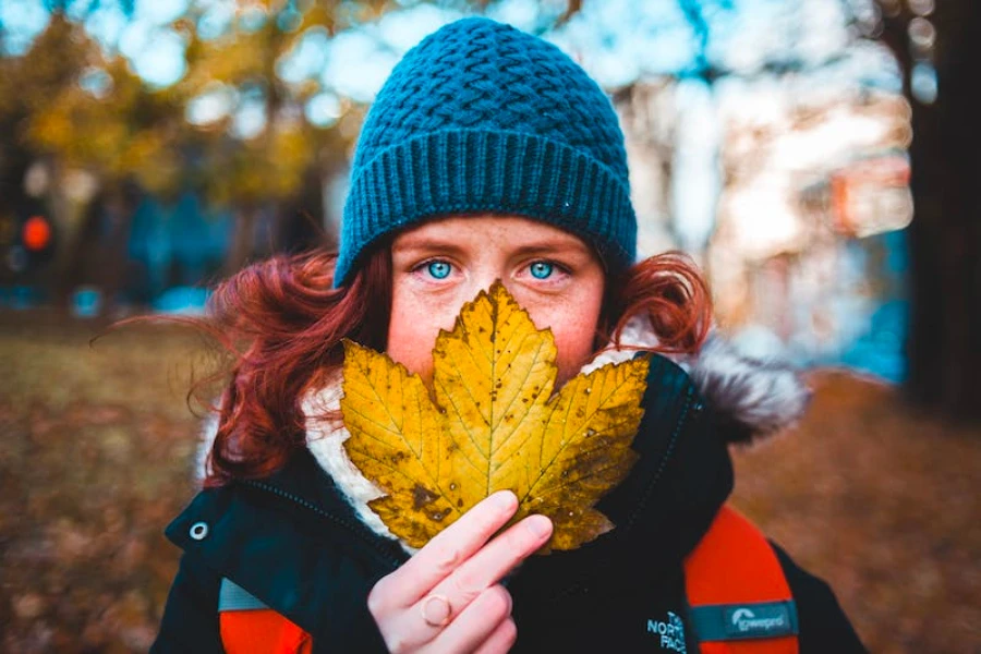 Girl wearing a blue beanie hat