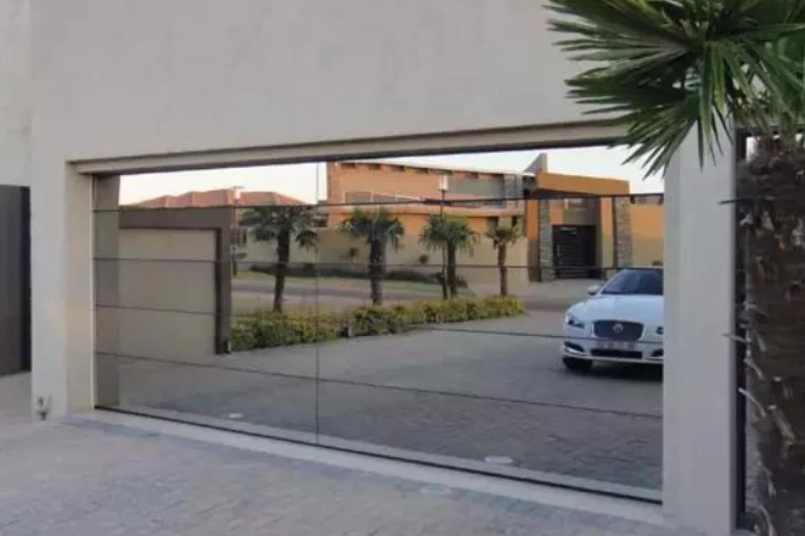 Mirrored sectional glass garage door