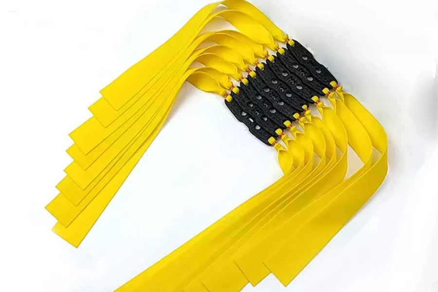 Pile of yellow rubber bands used for slingshot shooting