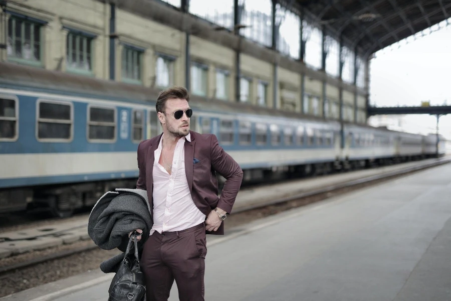 Man wearing a dusted grape-colored suit