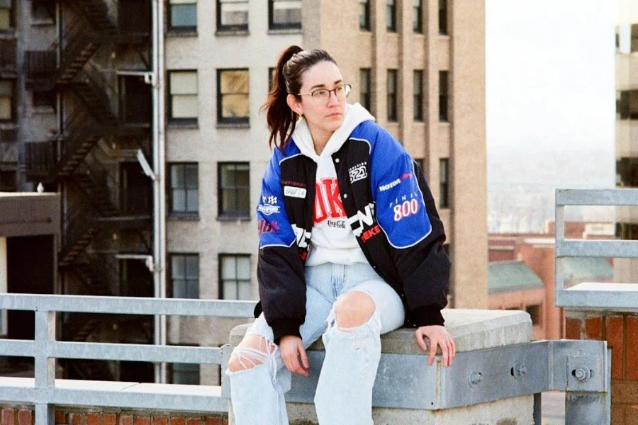 Woman on glasses wearing a printed winter jacket