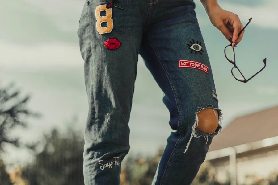 Lady posing in a DIY patch denim bottoms