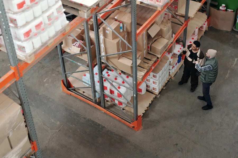 Men standing in a warehouse taking