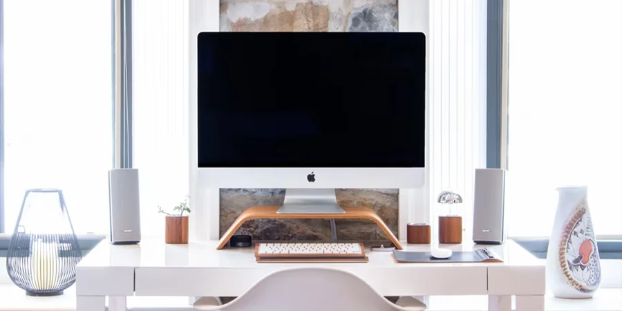 A desk with a computer in a home office