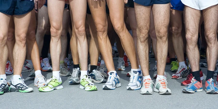 Group of runners down wearing different running shoes