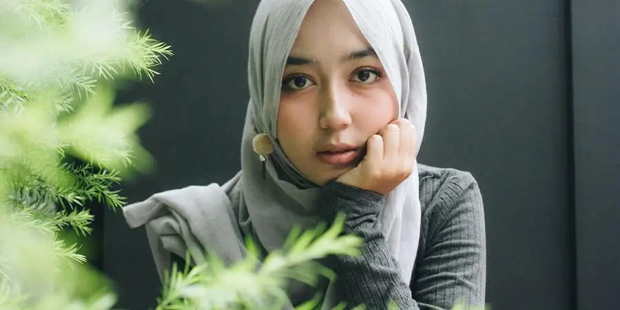 Muslim girl wearing a white hijab and makeup