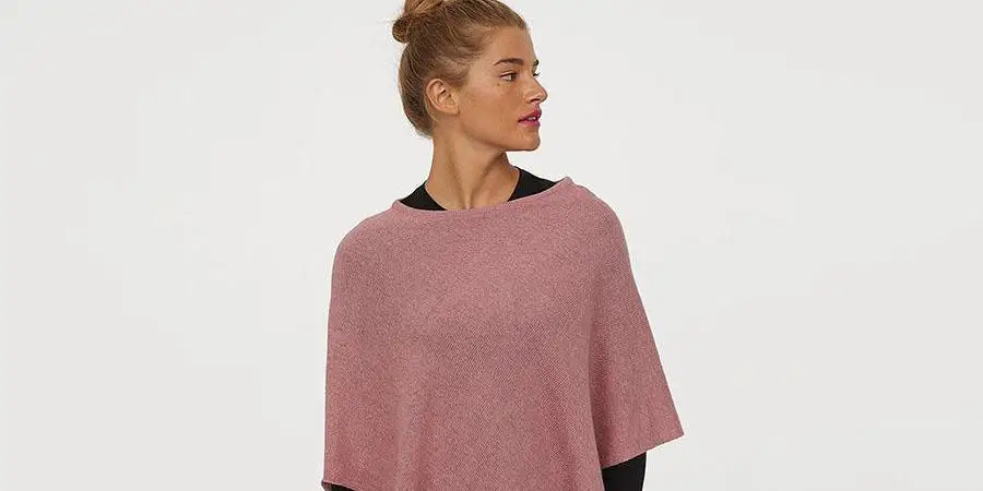 A lady in a pink poncho