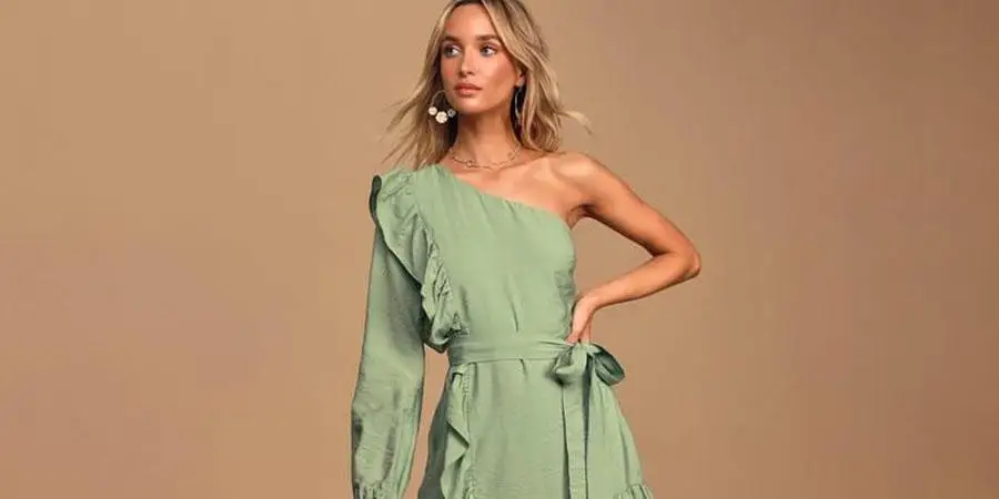 A woman in a green ruffle dress with belt