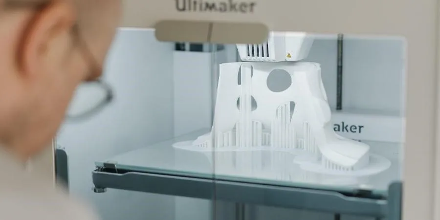 A specialist making a 3D print