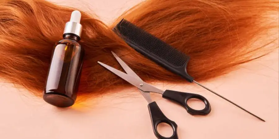 Ginger wig on table with hair cair accessories on top