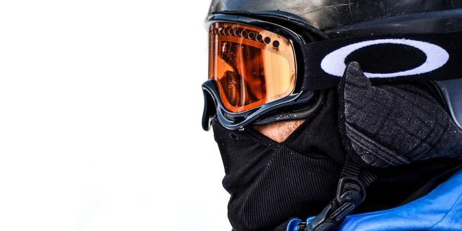 Person wearing ski mask and helmet
