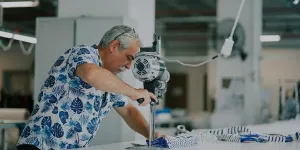 A man working with textile machinery