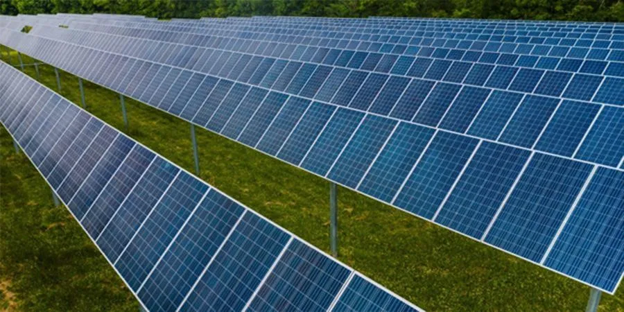An array of solar panels in a field