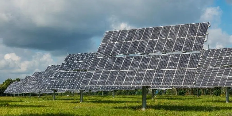 Black solar modules in an open field