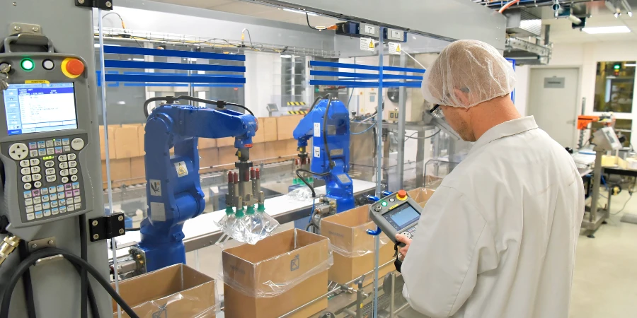 Medical products manufacturing in a modern factory - worker operates modern industrial plant