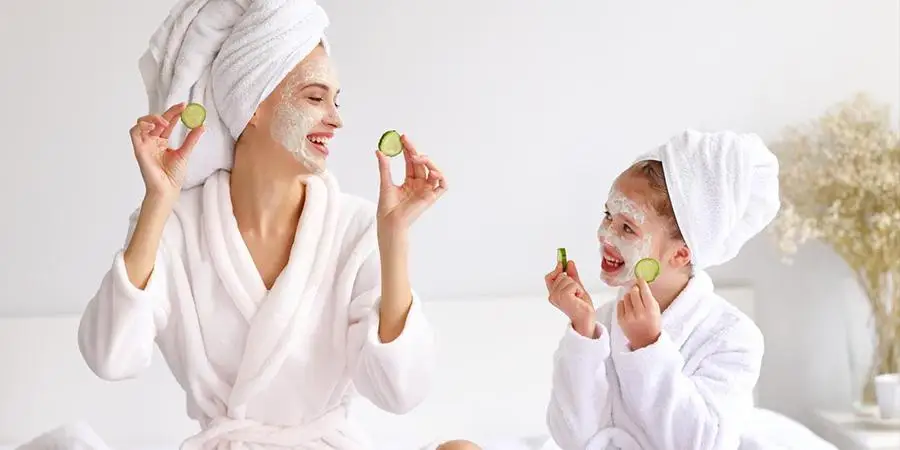 Mother and daughter doing skincare routine