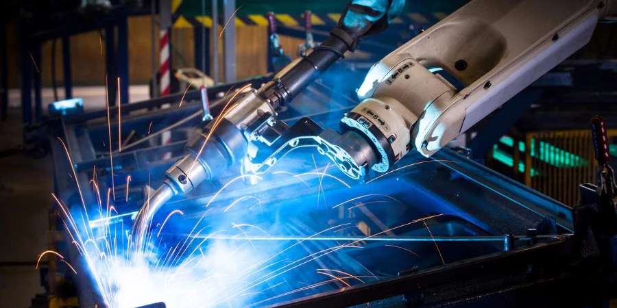 Robotic arm welding in a factory