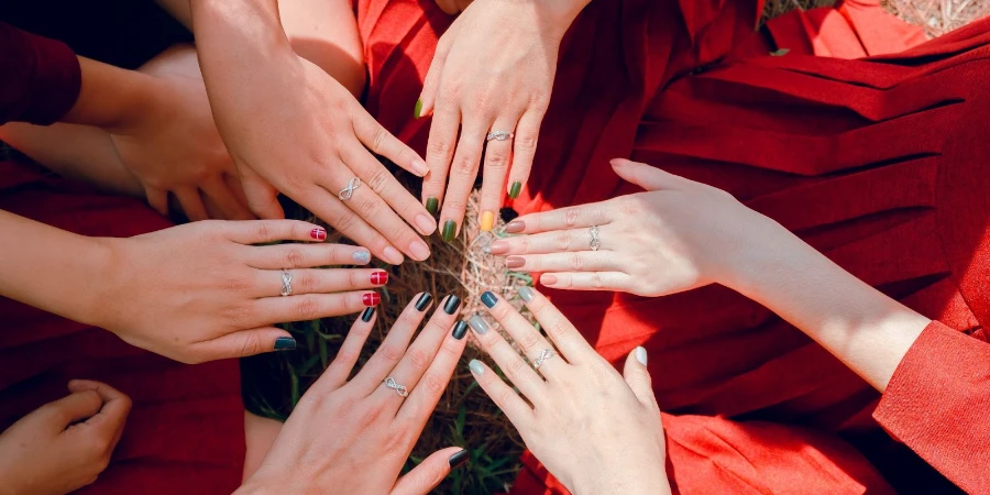 Six women with painted nails