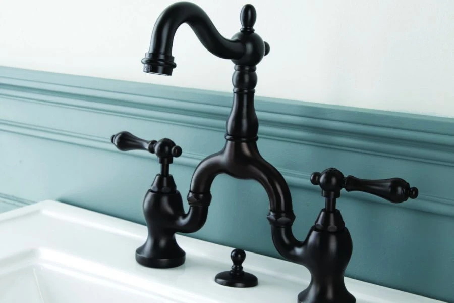 A black brass bridge bathroom sink faucet