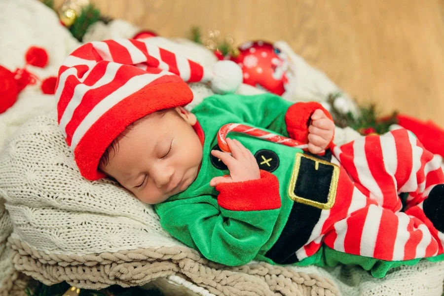 A cute baby dressed as an elf