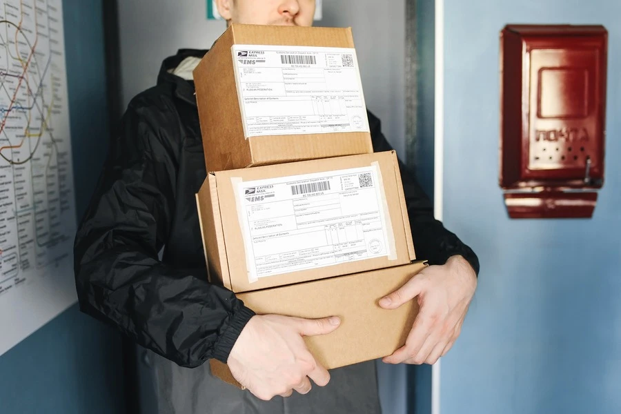 A delivery man with a pile of packages
