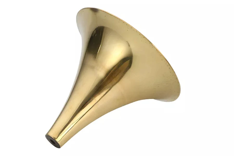 A gold lacquer copper horn cone on white background
