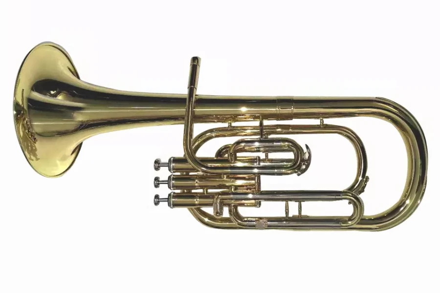 A gold lacquer sax horn laid on its side