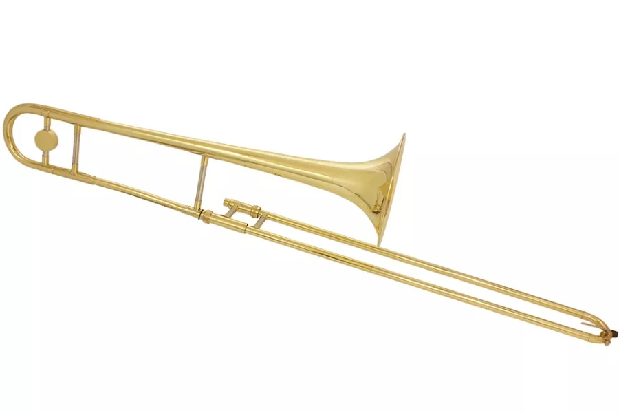A gold lacquer trombone on a white background