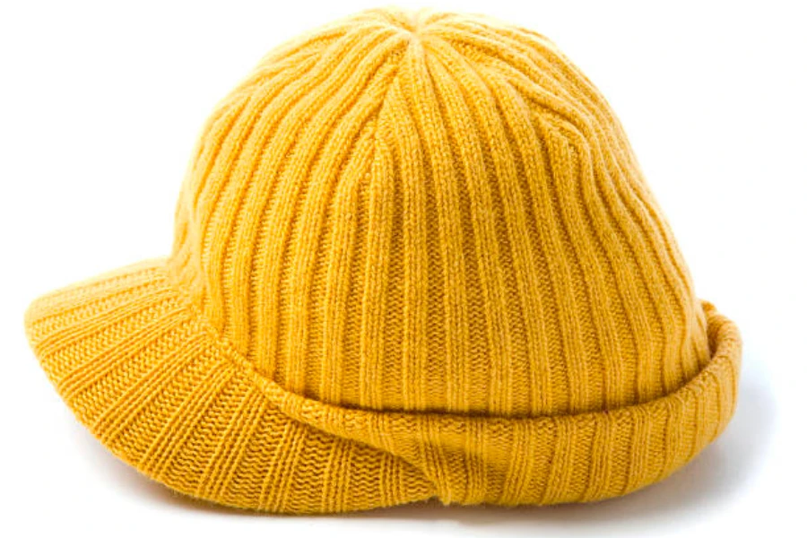 A yellow knitted beanie cap