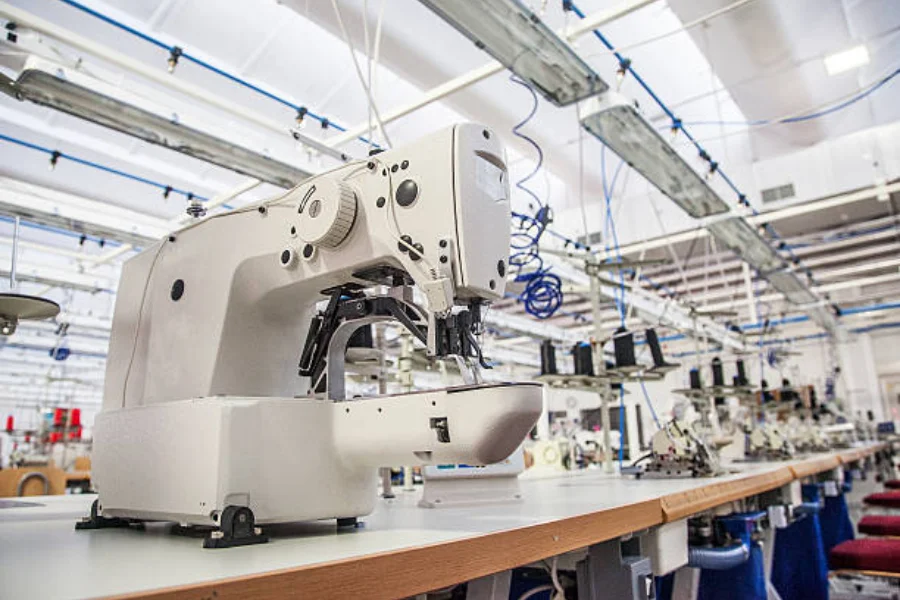 An industrial sewing machine in a textile factory