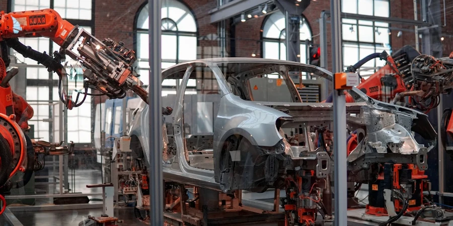 Autonomous robots assembling a car in factory