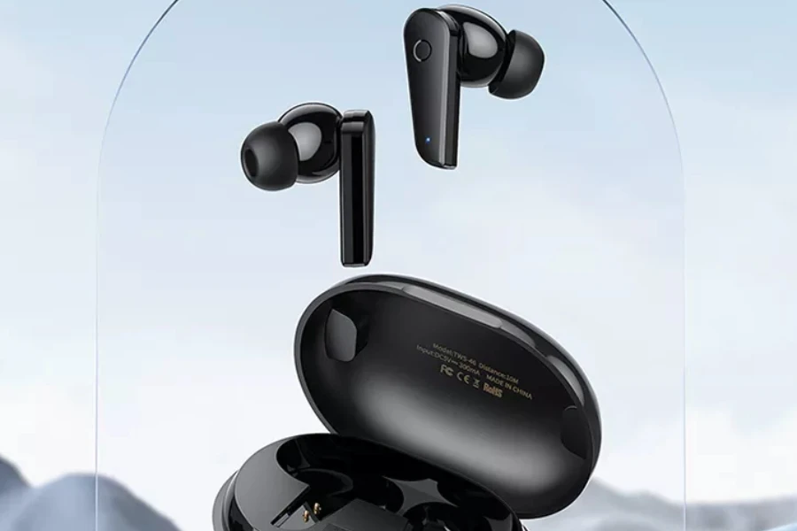 Black earbuds hovering above the case