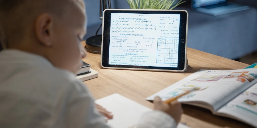 Child doing homework with a tablet