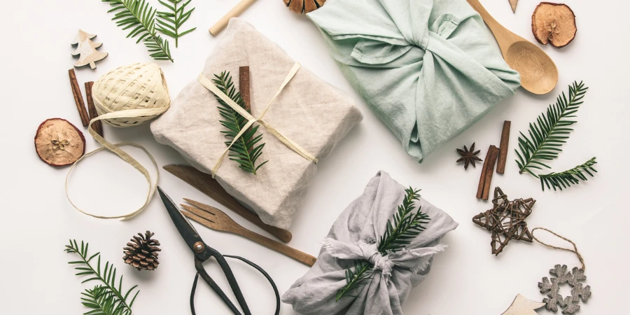 Fabric-wrapped gifts and wooden Christmas decorations