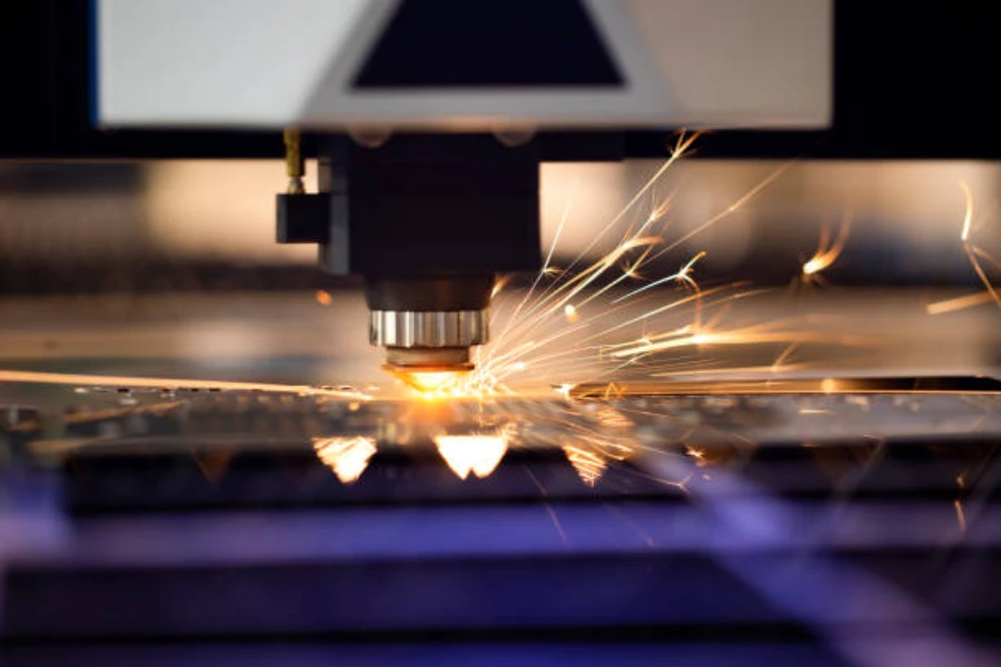 Industrial laser machine drilling metal parts