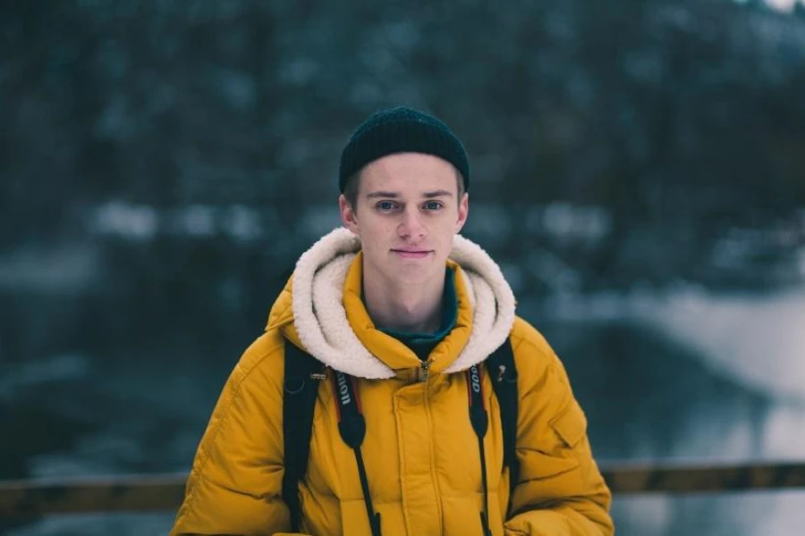 Man in dark green knitted fisherman hat