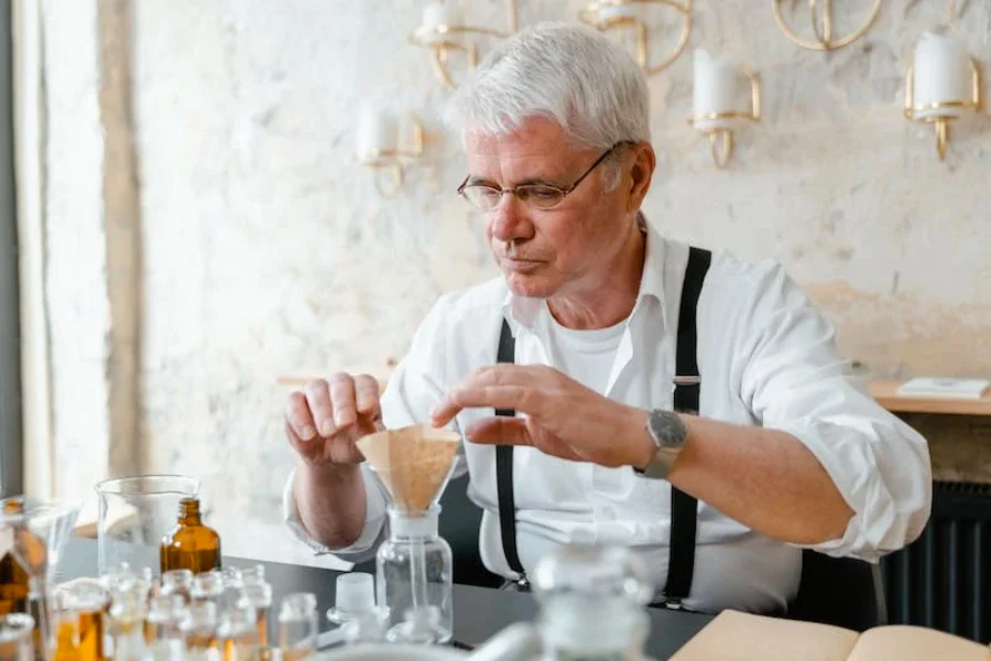 Man making different perfumes