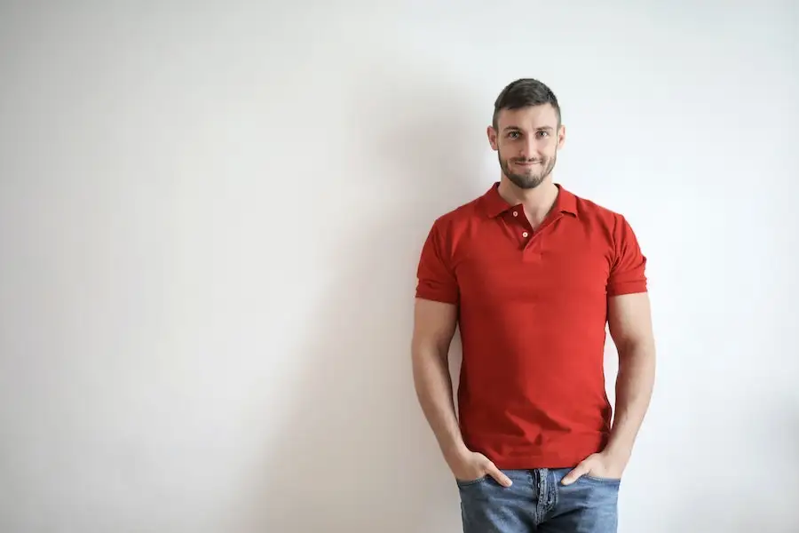 Man posing in a red polo shirt