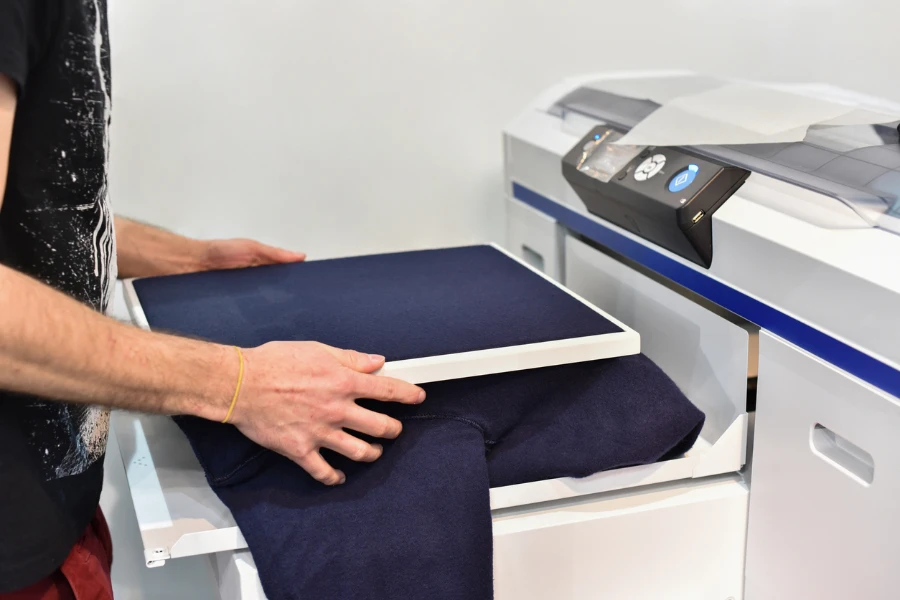 Man printing a t-shirt