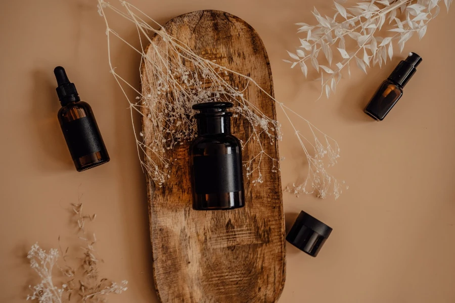 Perfume bottles on a wooden board