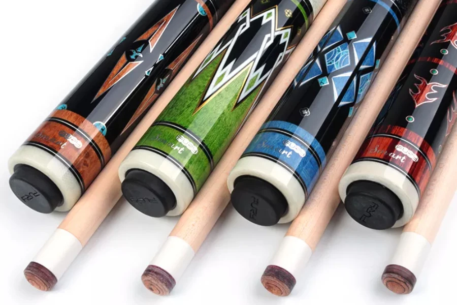 Row of cue sticks with fashionable decals on the handle
