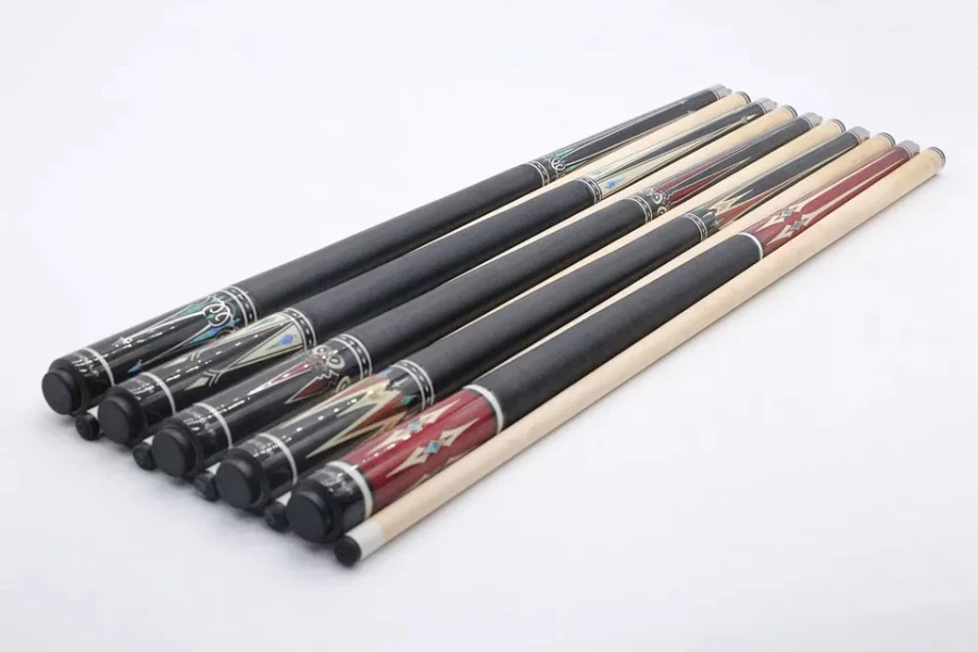 Selection of maple cue sticks with different patterns on handle