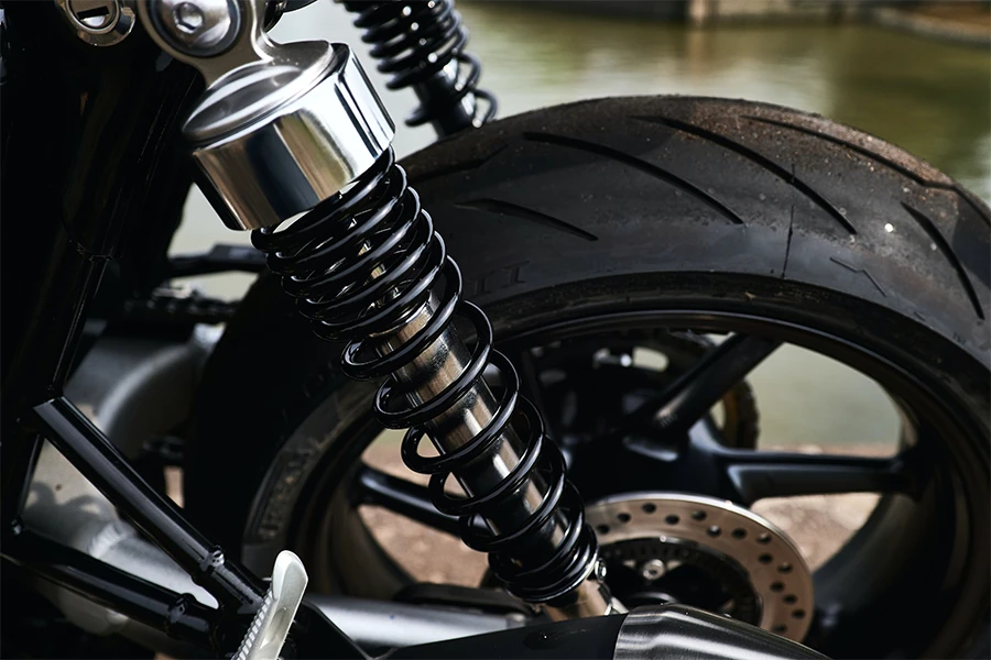 Steel shock absorbers attached to a bike wheel