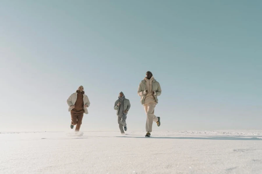 Three men running in winter gear