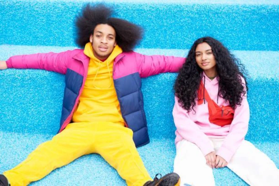 Two young people in bright colored activewear