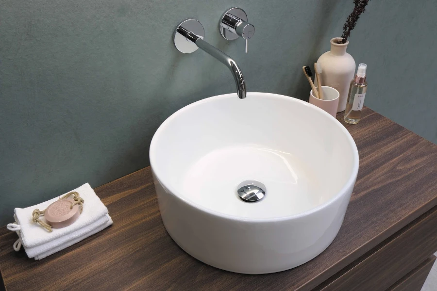 White ceramic sink with stainless steel faucet