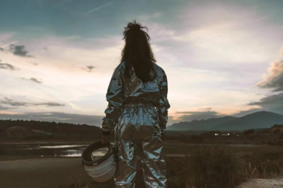 Woman at the beach wearing a space suit