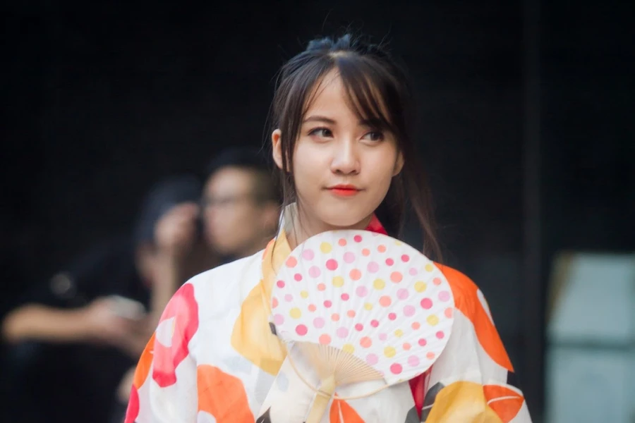 Woman in a kimono wearing a peach lipstick