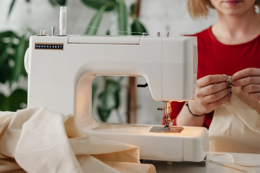 Woman in red shirt sewing