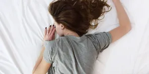 Woman sleeping with sleep time skincare